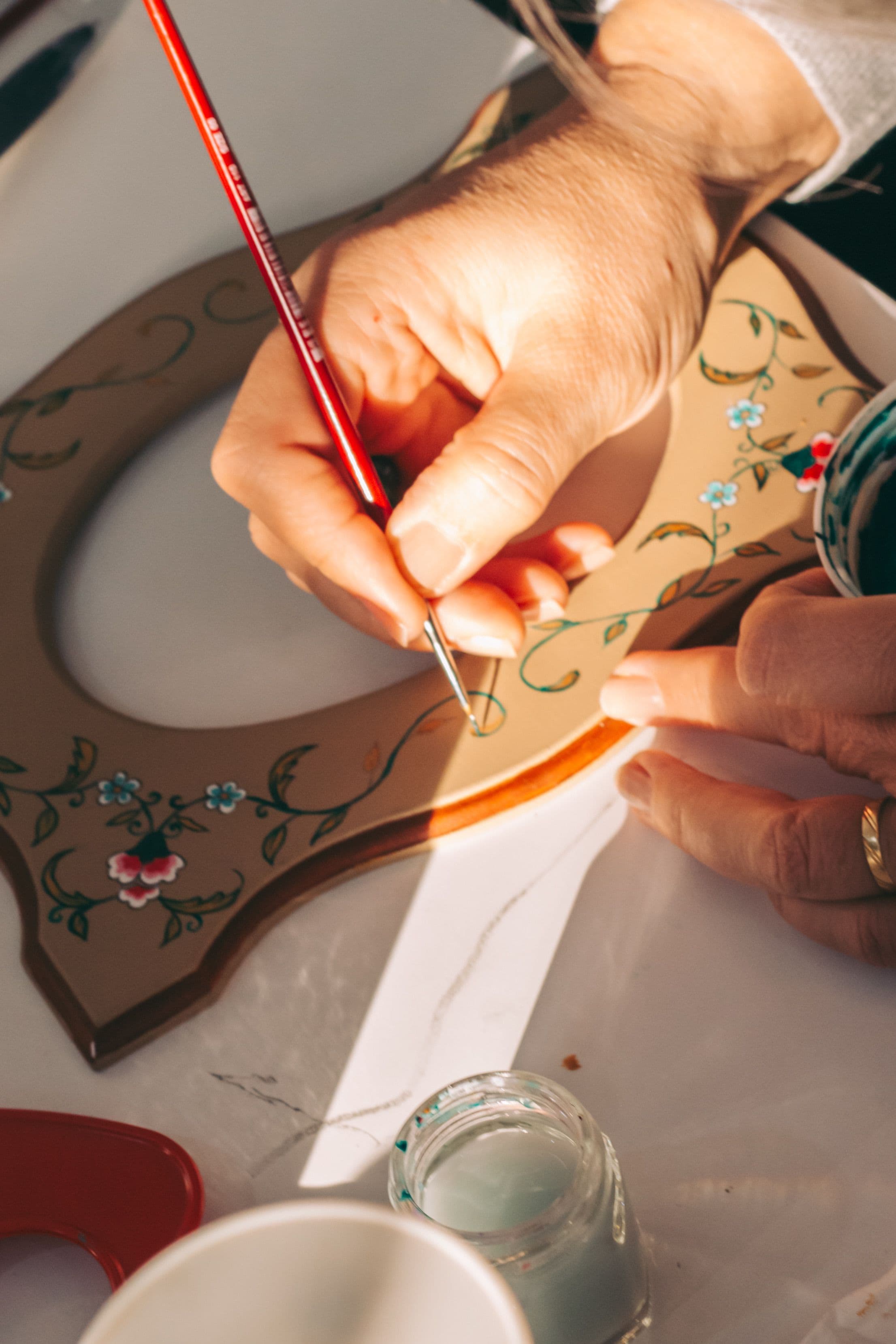 Hand-painting a folk craft ornament